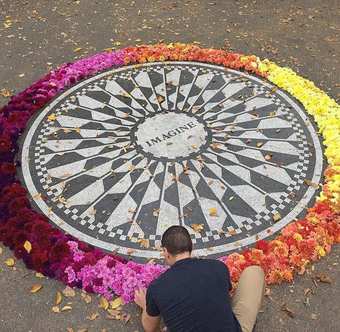 imagine memorial covered in flowers new york