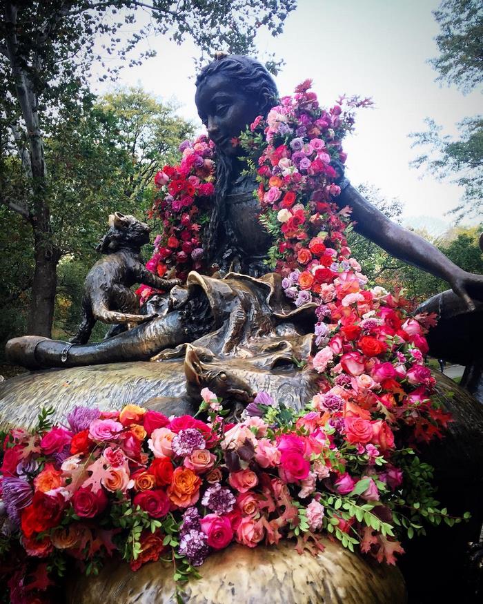 central park statue covered in flowers new york