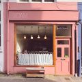 LOAM coffee shop, pink shopfront with curtained window on Gloucester Road