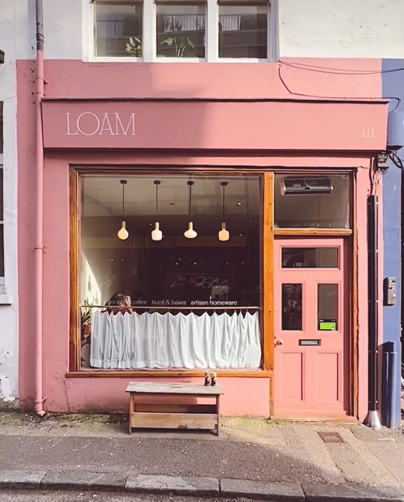 LOAM coffee shop, pink shopfront with curtained window on Gloucester Road