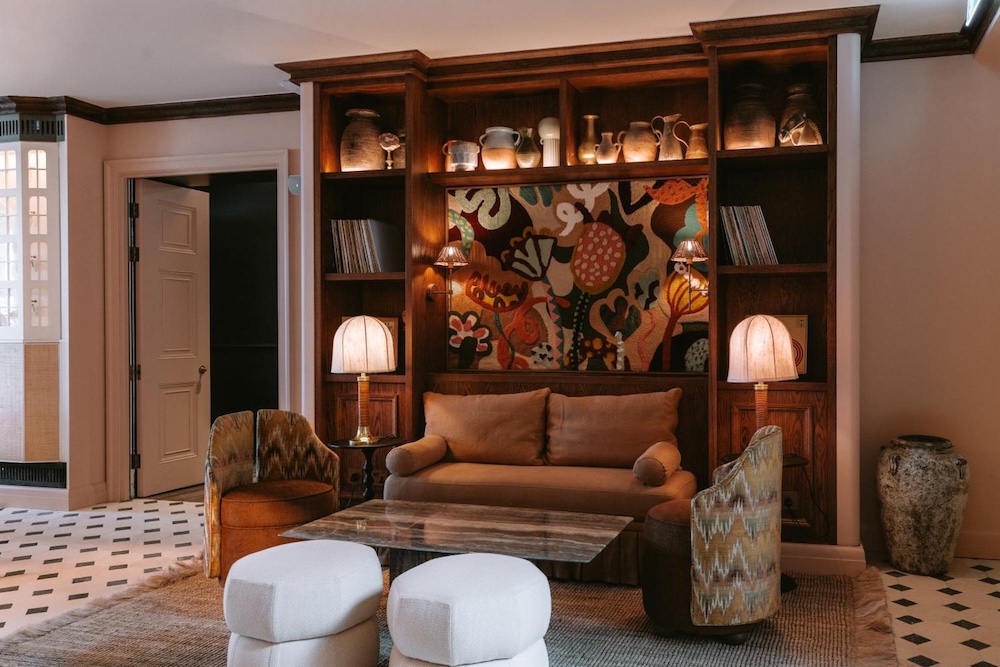 Colourful lounge at No.124 by GuestHouse Brighton with vintage furniture and artwork
