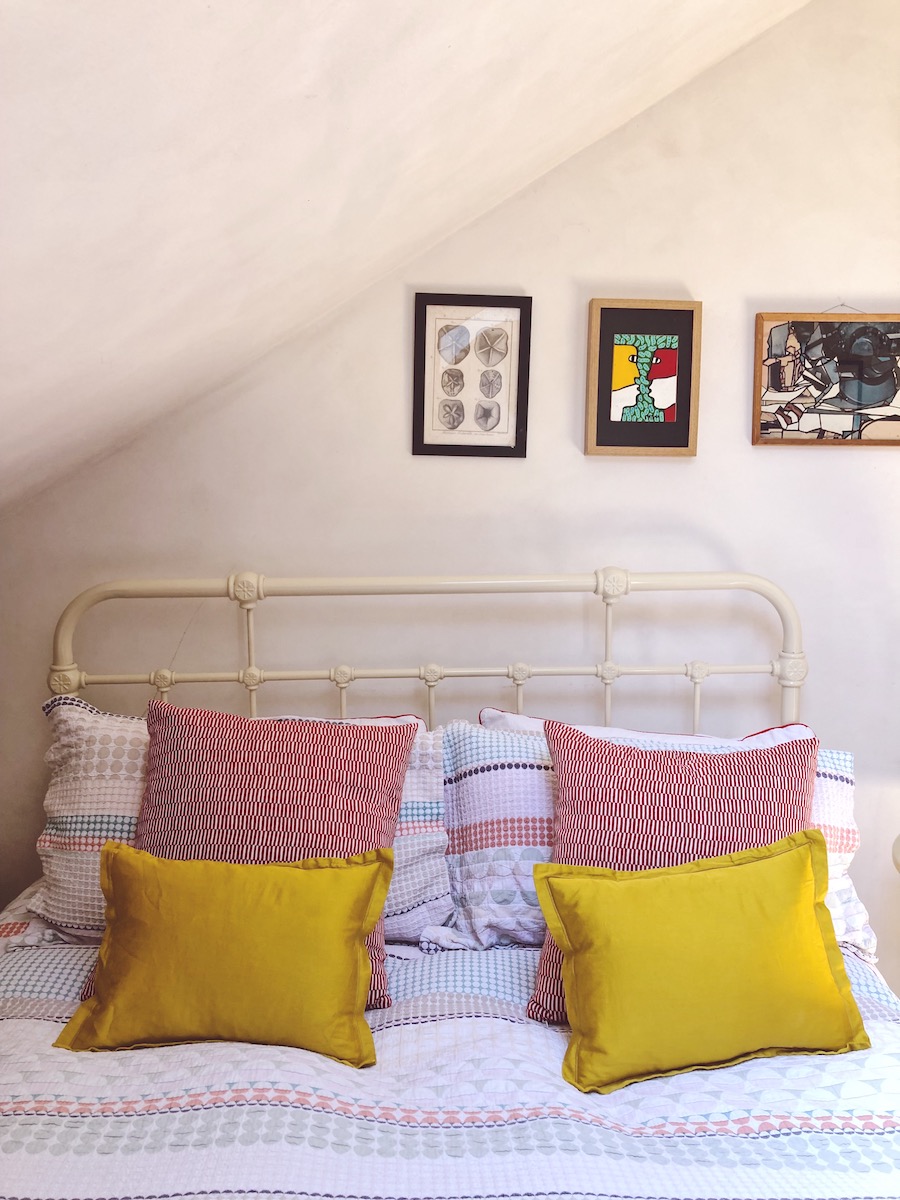 yellow cushions on bed