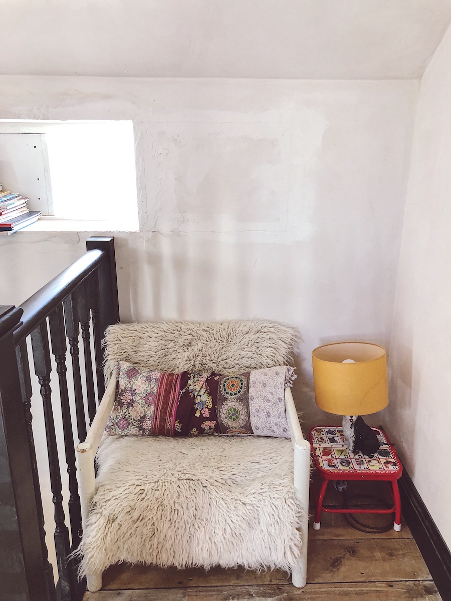 chair and sheepskin throw