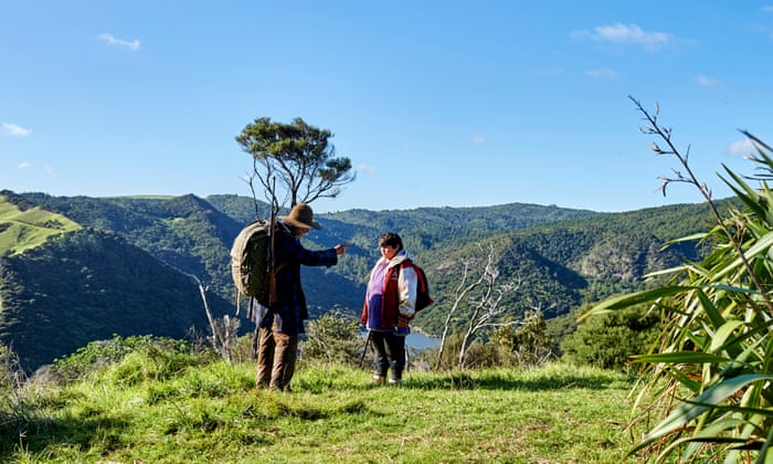 man and boy walking in new zealand