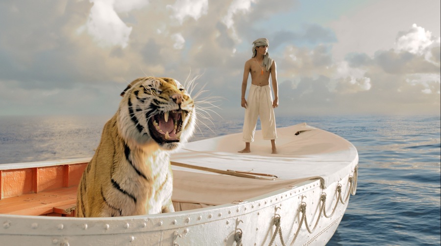 boy and tiger on boat