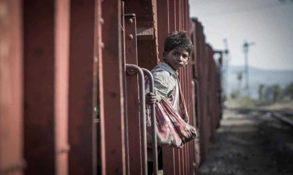 boy on train in india