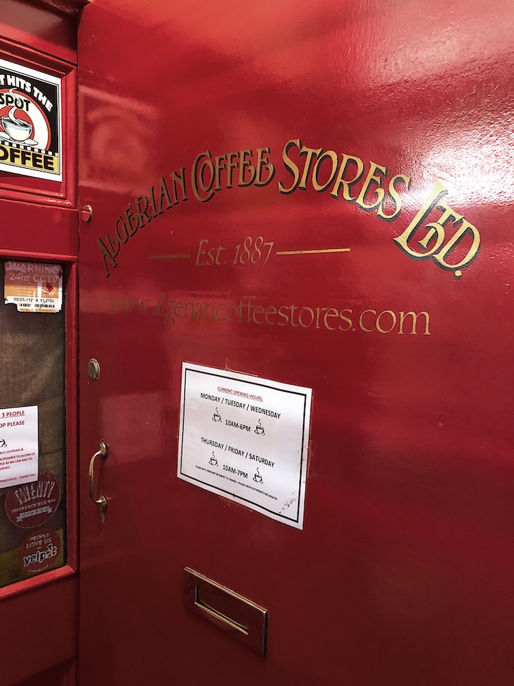 red front door with old fashioned gold writing 