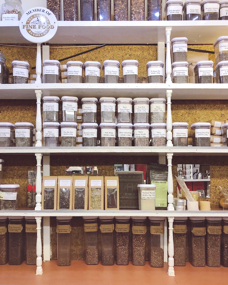 shelves filled with jars of tea