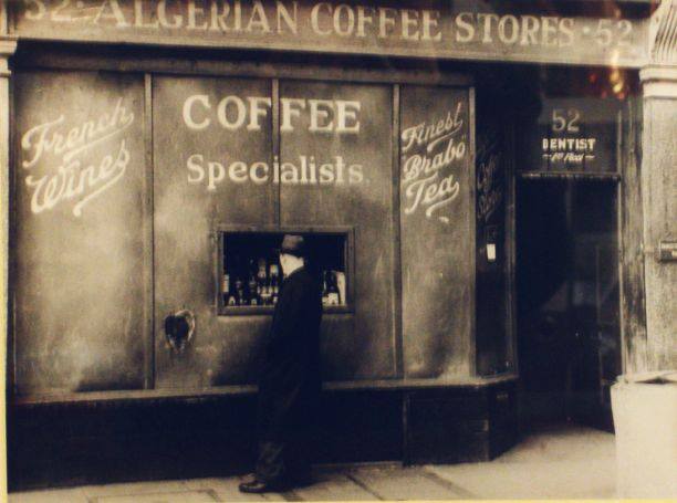 black and white photo of old shopfront
