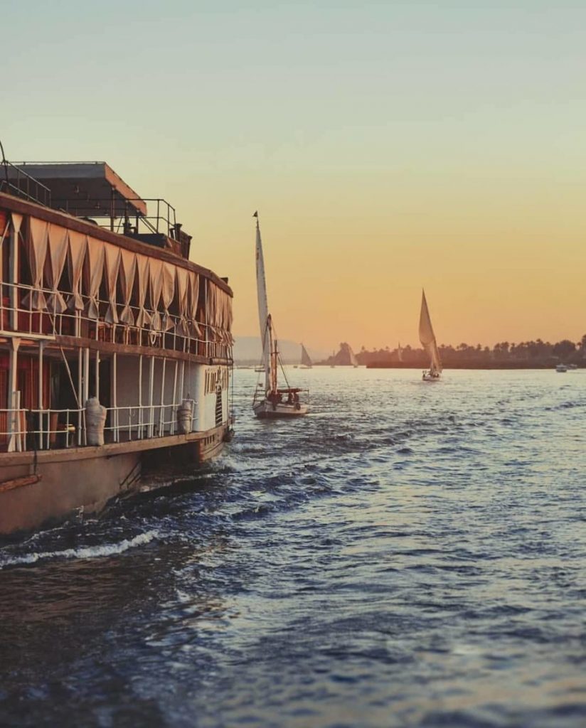 steamship sailing into sunset