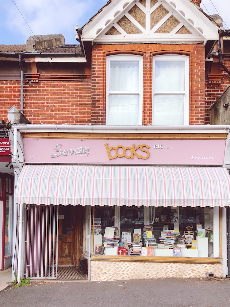 victorian shopfront with pink stripy canopy
