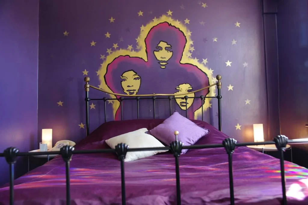 purple bedroom with mural