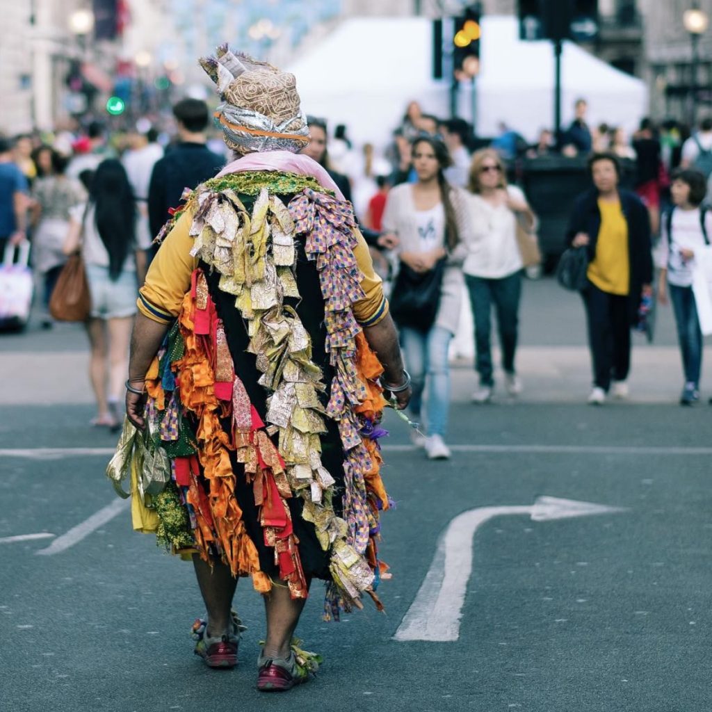 picture of a lady wearing a brightly coloured long dress