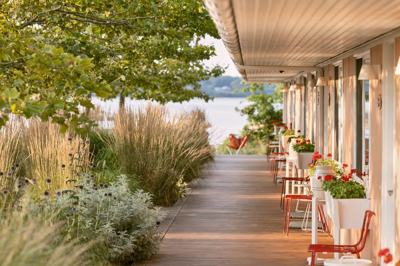 Waterfront motel rooms and landscaped gardens at Silver Sands Motel & Beach Bungalows in Greenport, New York