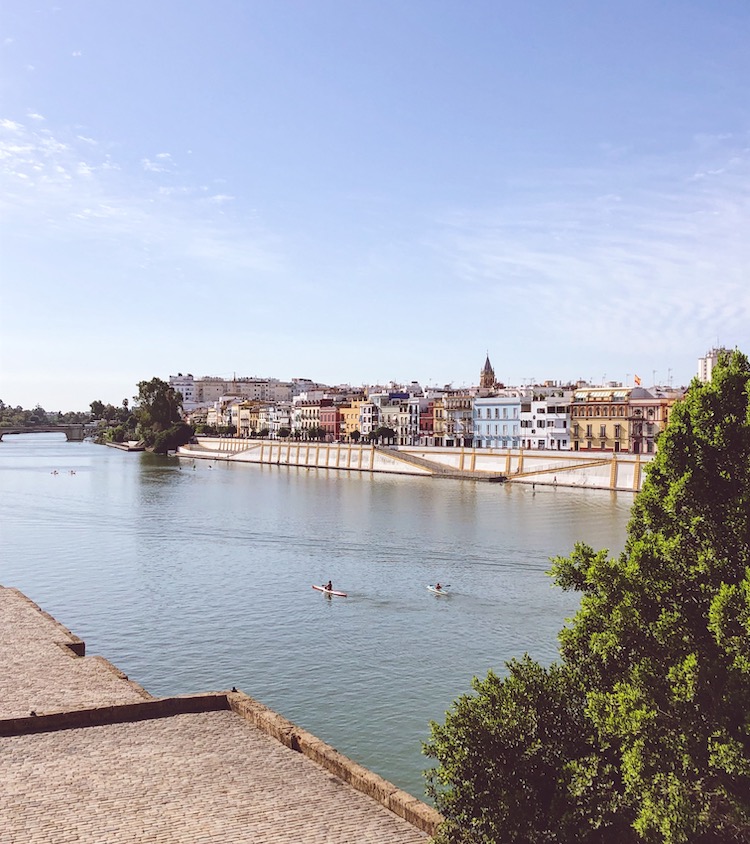 Triana's colourful riverfront across the Guadalquivir, Seville